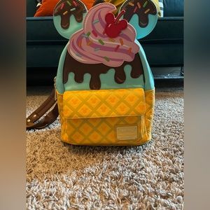 Loungefly backpack with ice cream sundae print and sprinkles on mouse ears .